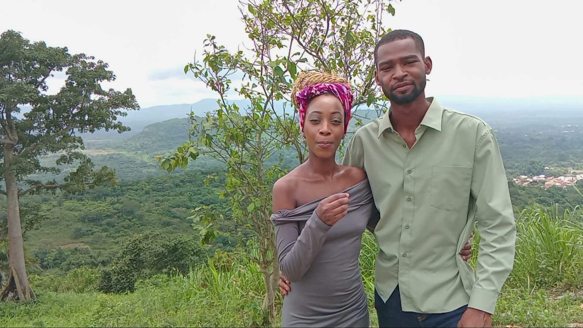The founders of Ubuntu Eco Gardens standing together overlooking the Adaklu landscape